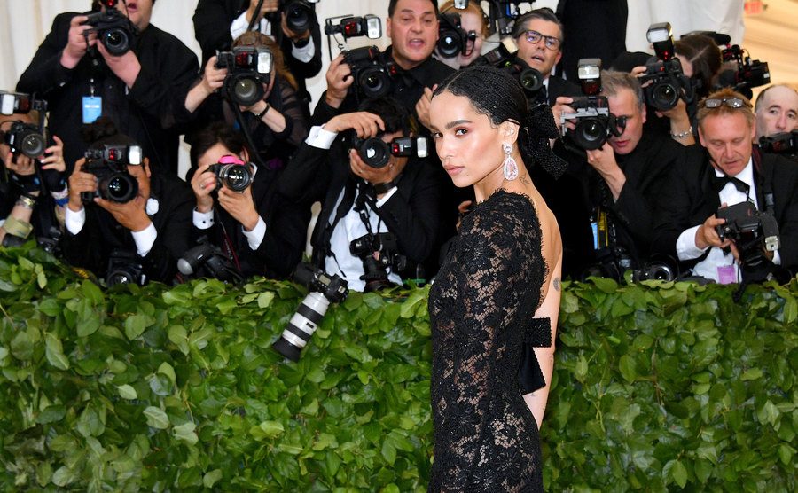 Zoe Kravitz attends the Met Gala as the paparazzi take her picture. 