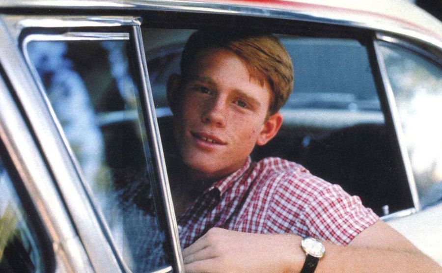 Ron Howard drives his car. 