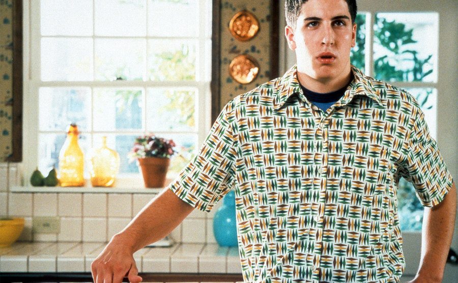 Jason Biggs stands next to the apple pie in his kitchen. 