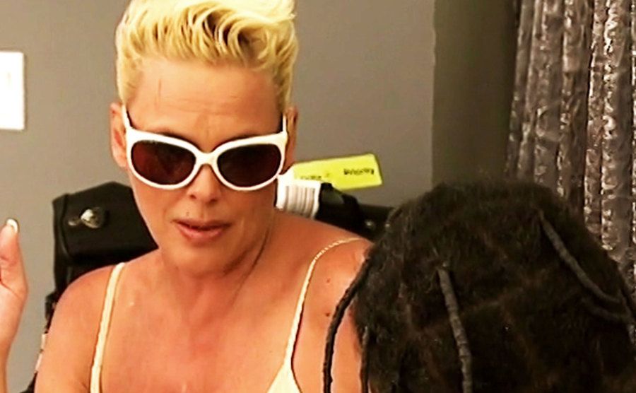 A still of Nielsen and Flav during a conversation in a scene from the show.