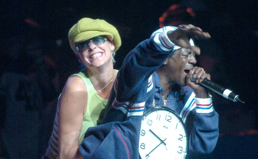 Nielsen embraces Flav on stage during his performance.