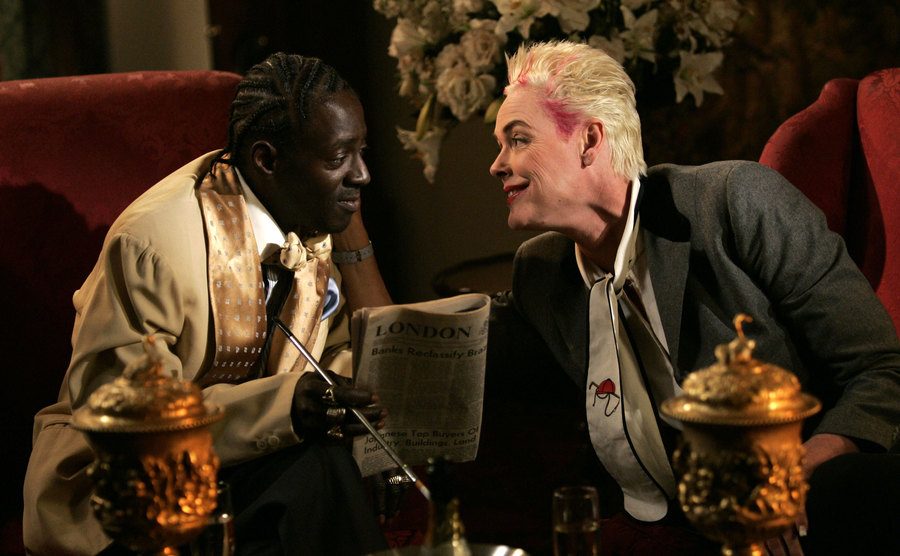 A portrait of Flav and Nielsen talking to each other.