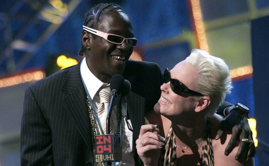 Flav and Nielsen speak on stage.