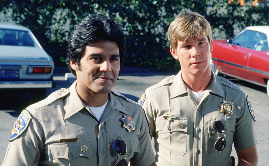 A still from an episode in a parking lot.