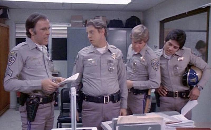 A still from the show inside a police station.