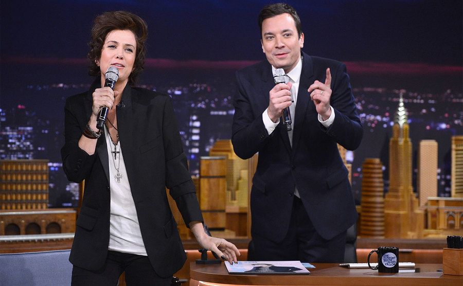 Kristen Wiig impersonates Harry Styles during a taping of