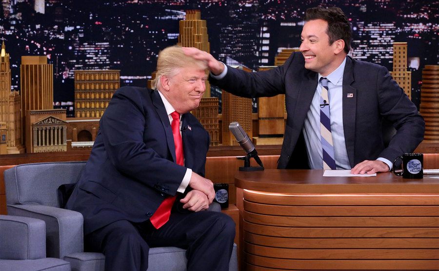Fallon is running his hands through Trump’s hair during the interview.