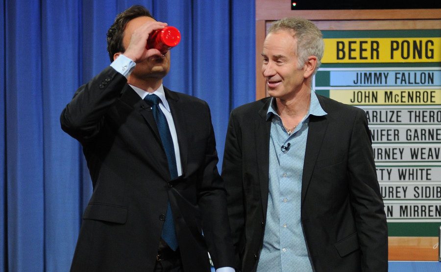 Jimmy Fallon and tennis player John McEnroe play beer pong on the