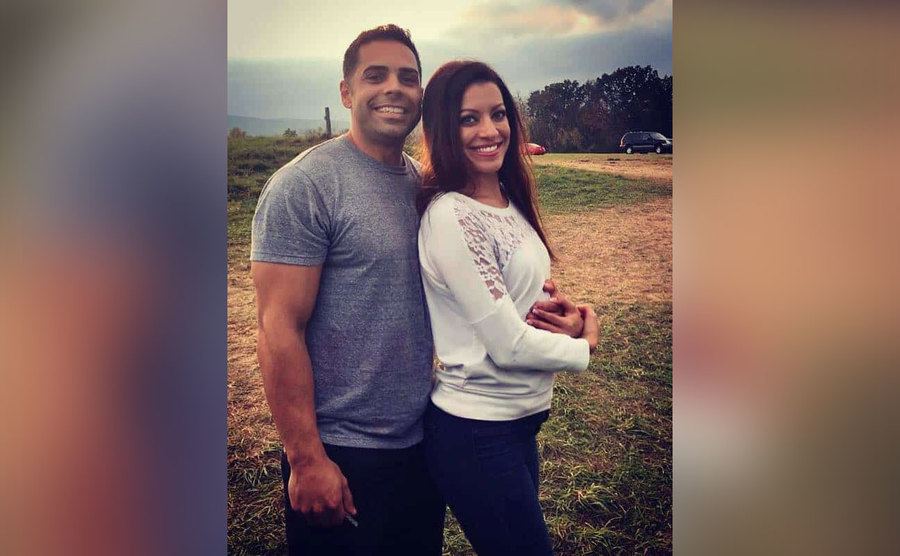 Jaclyn Methuen and Ryan Ranellone pose out in nature.