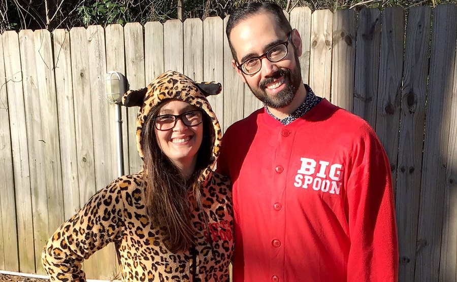 Samantha Role and Neil Bowlus show off their onesies.