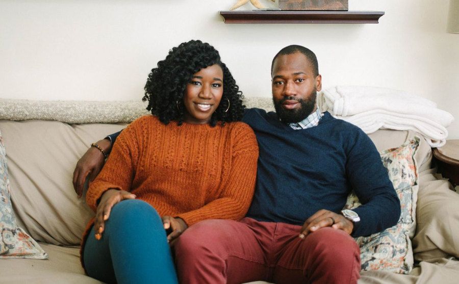 Jasmine McGriff and Will Guess are sitting on a couch.