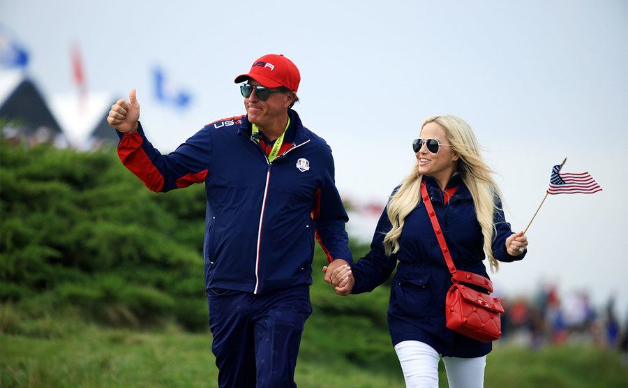 Phil Mickelson and Amy Mickelson look on during Sunday Singles Matches