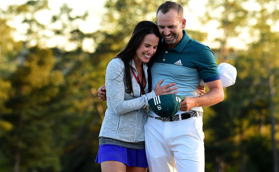 Sergio Garcia embraces Angela Akins in celebration after defeating Justin Rose.