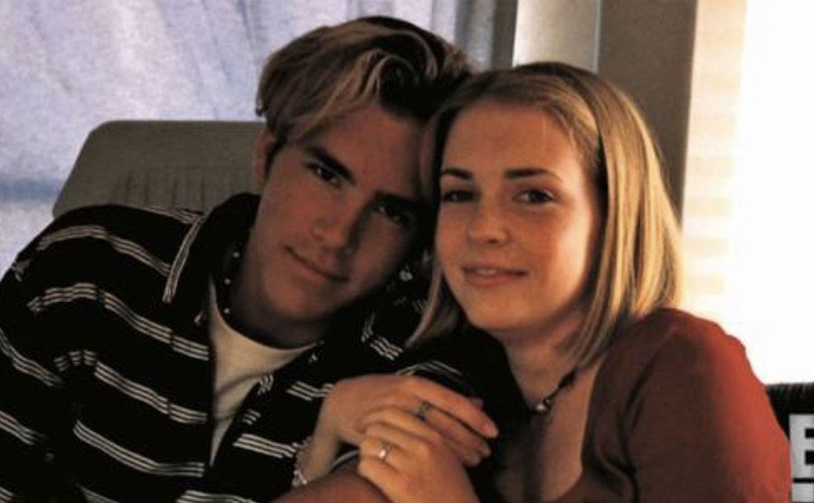 Melissa and Ryan pose for a photo on set.