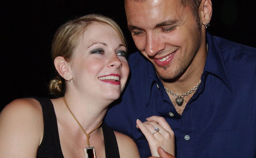 Melissa Joan Hart and fiance Mark Wilkerson admire Harts's ring.
