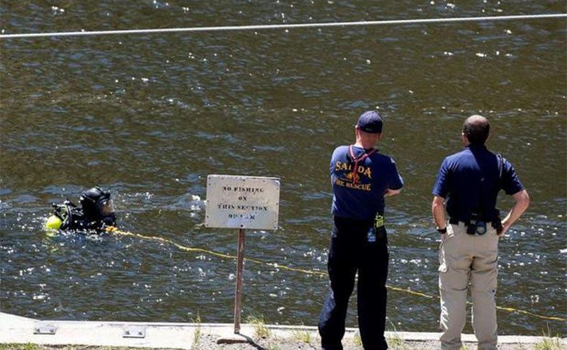 A photo of police searching for Suzanne.