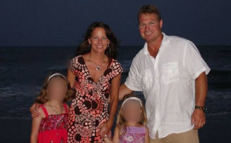 A dated picture of Suzanne with her husband and children.