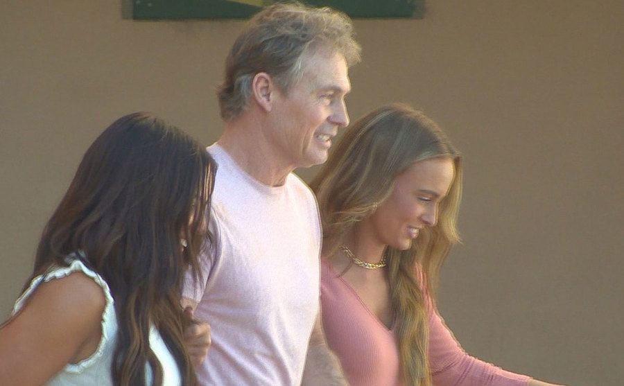 A photo of Barry outside court with his daughters.