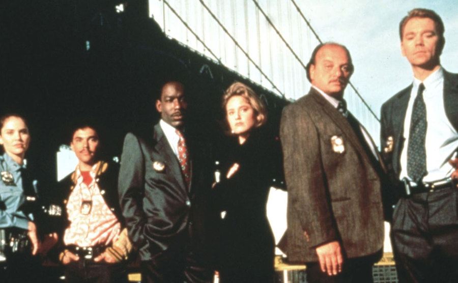 The cast poses for a promotional portrait.