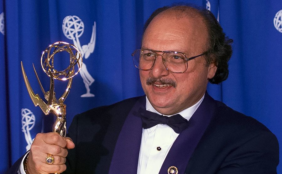 Dennis poses backstage at the Emmys.