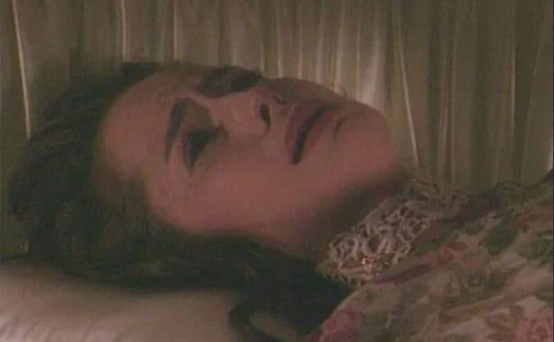 A still of the scene where Carly Manning cries inside a coffin.