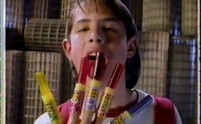 Ryan Reynolds has multicolored Push Pops on his fingers.