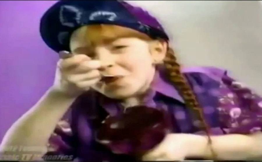 Lindsay Lohan gobbles a spoonful of Jell-O.