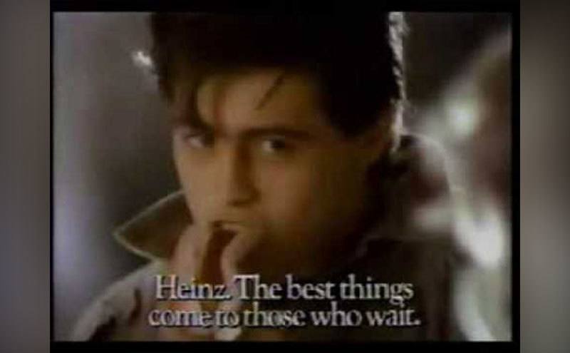Matt LeBlanc is eating a hot dog.