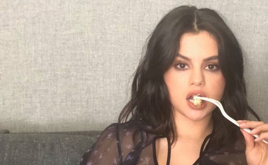 Selena Gomez is eating.