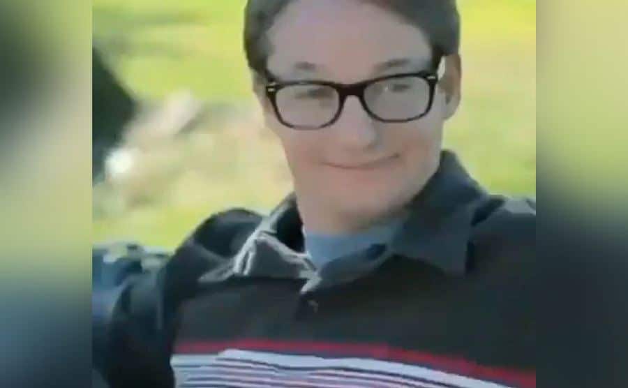 Tobey Maguire sits on a park bench in a Doritos ad.