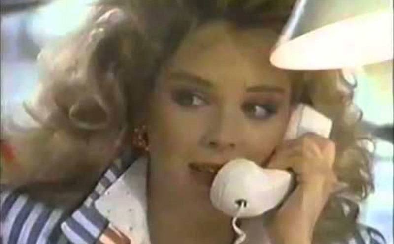 Sharon Stone talks on the phone during a Finesse Shampoo commercial.