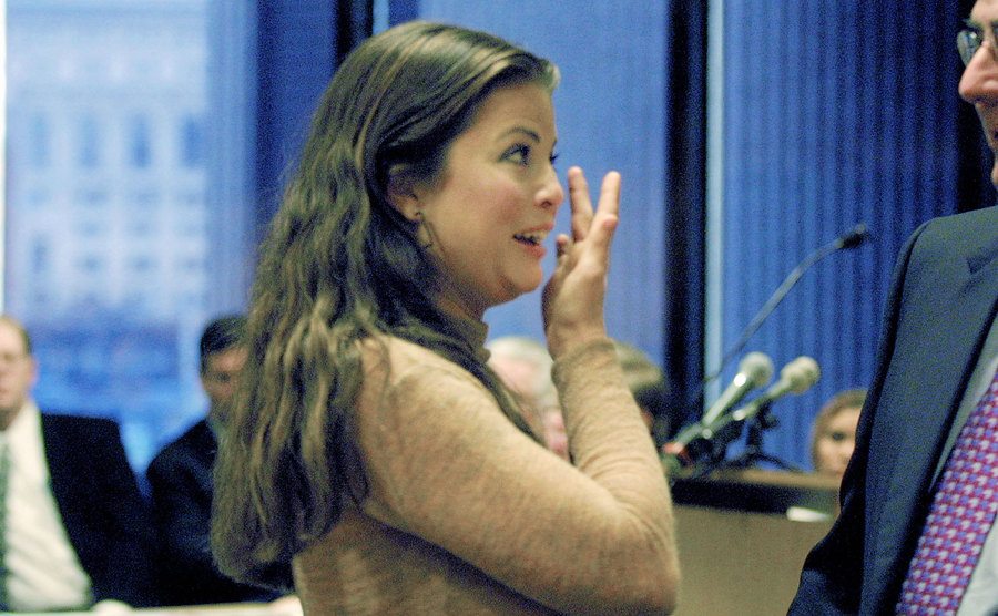 Bleeth wipes away her tears while speaking with her attorney.