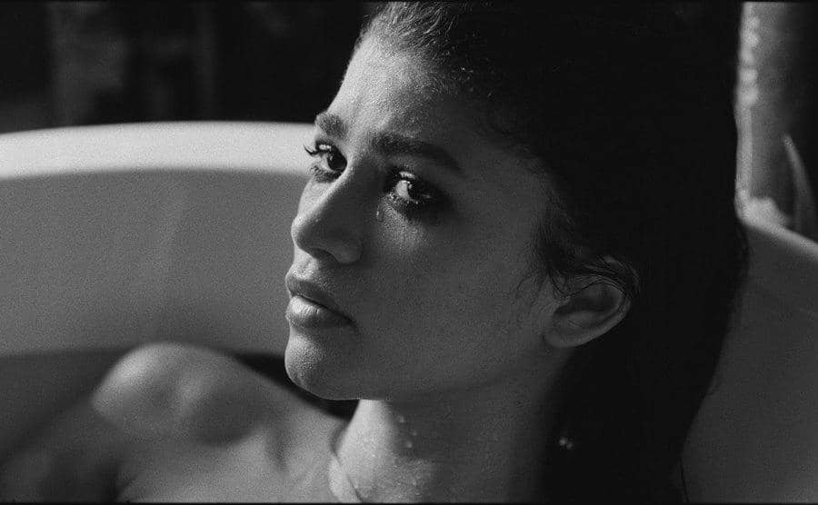 Zendaya, as Marie, is in the bath.