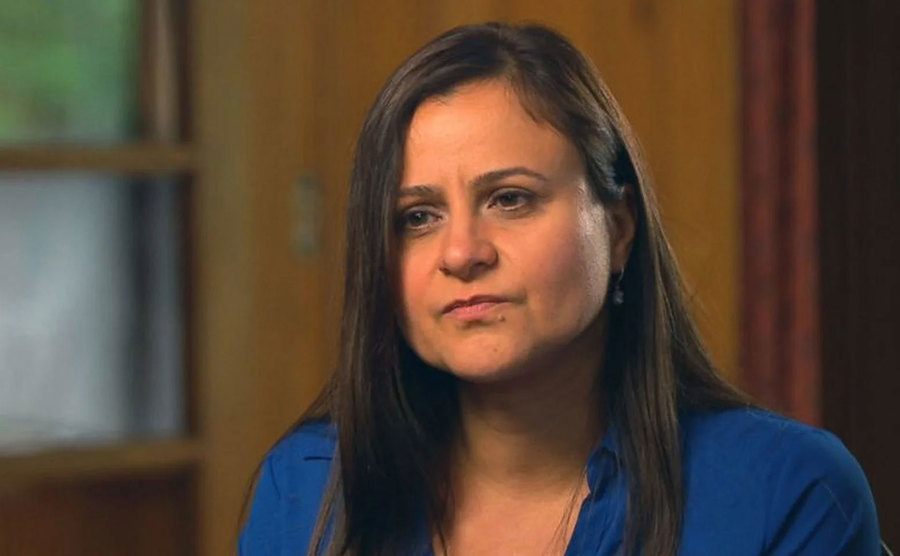 Zenya speaks during a televised interview.