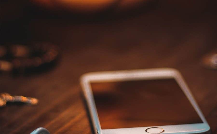An image of a cellphone lying on a table.