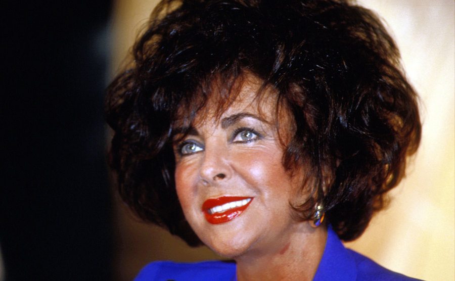 A dated portrait of Elizabeth Taylor.