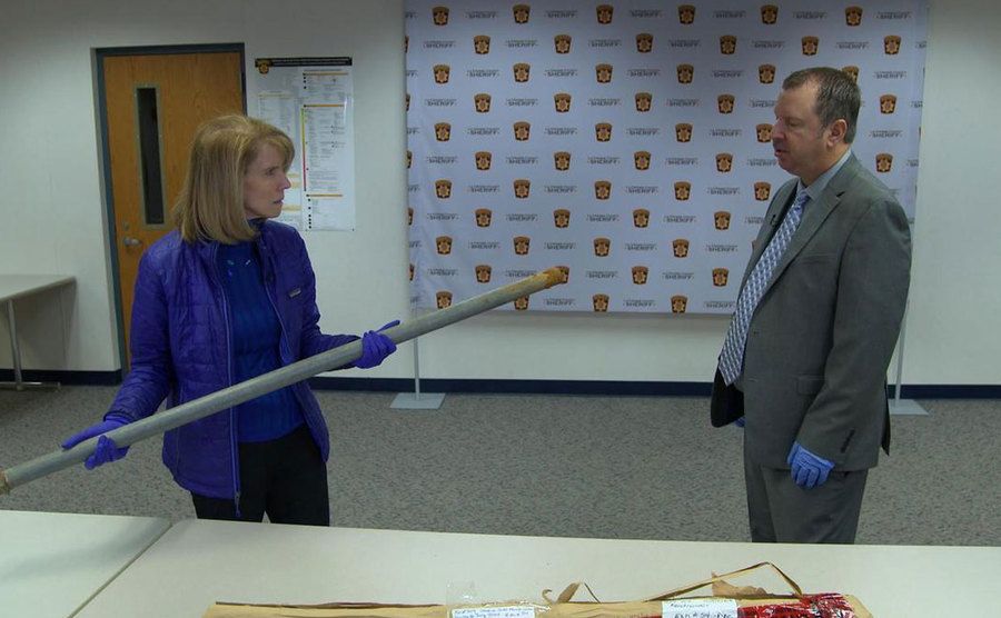 An image of a reporter holding the pipe.