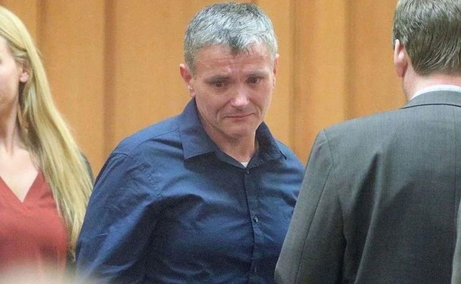 An image of Todd crying in the courtroom.
