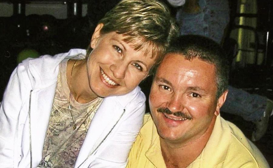 A dated picture of Barbara and Todd smiling at the camera.