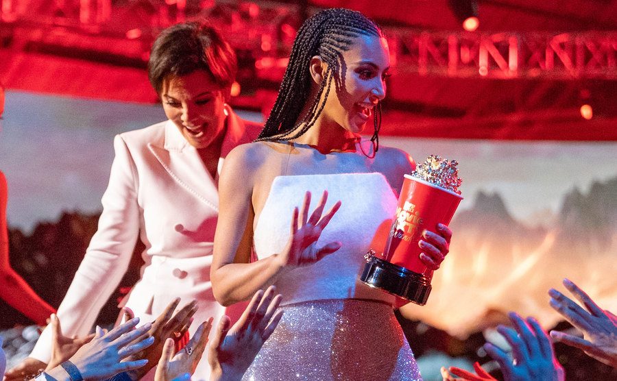 A photo of Kim Kardashian walking off stage at an awards ceremony.