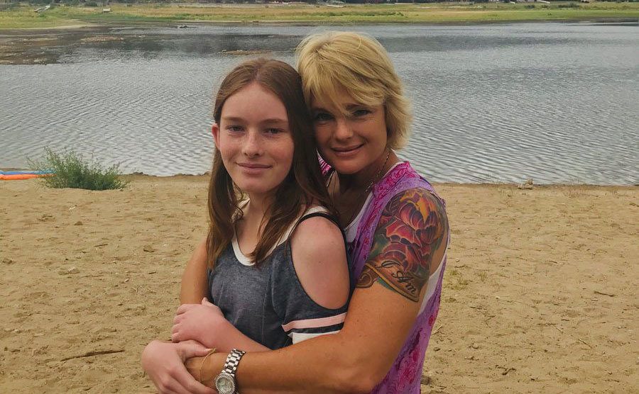 Erika and her daughter pose together on a trip.
