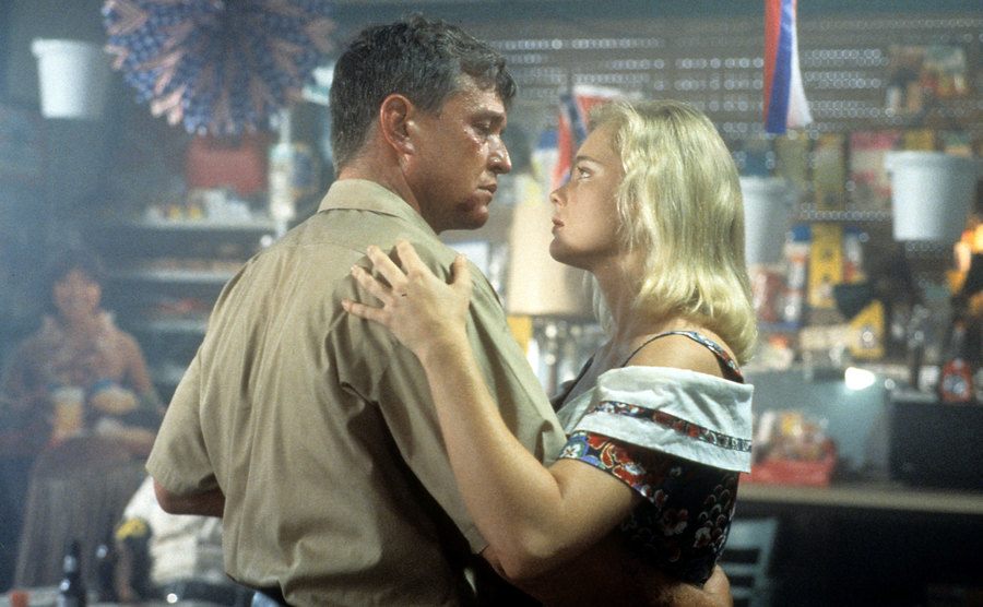 Tom Berenger and Erika Eleniak dancing in a scene from the film 'Chasers'.