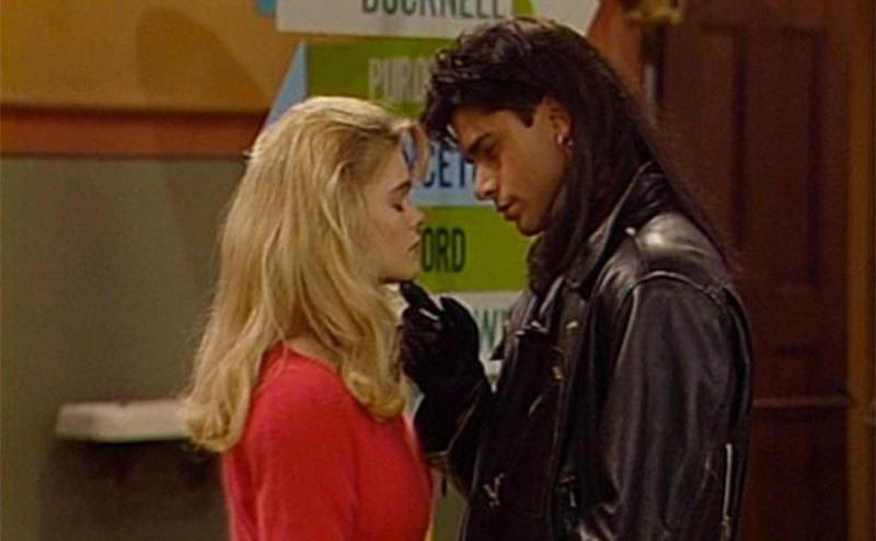 Erika and John Stamos in a still from Full House.