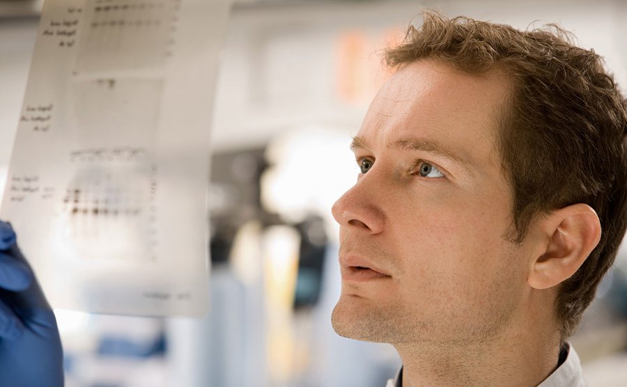 An image of a scientist looking at a DNA Test.