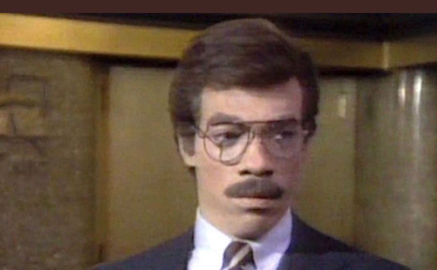 Eddie Murphy in white face makeup. 