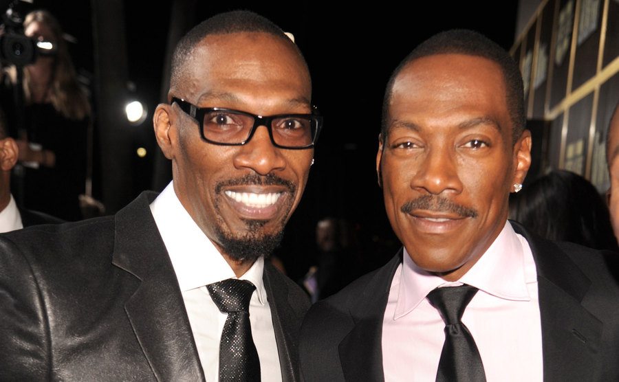 Charlie Murphy and Eddie Murphy arrive at an event. 