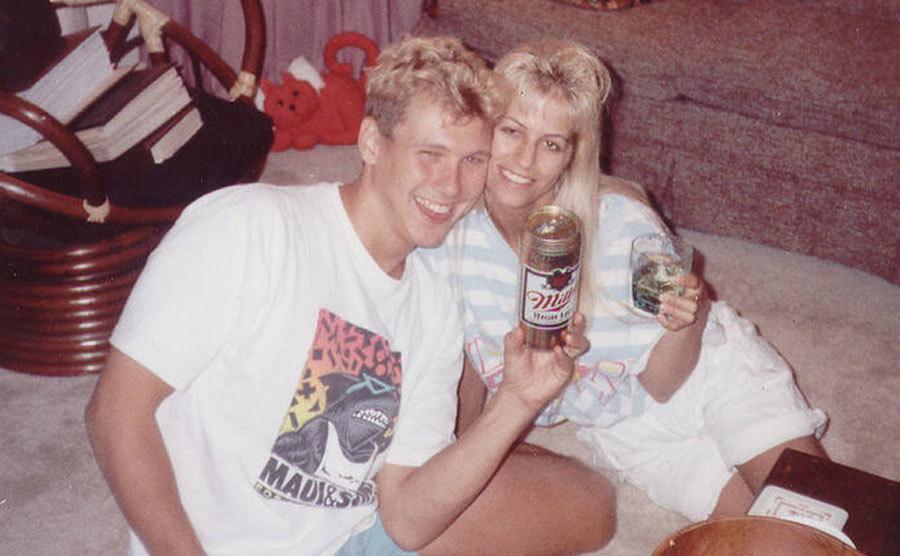 A picture of Paul and Karla smiling at the camera during a party.