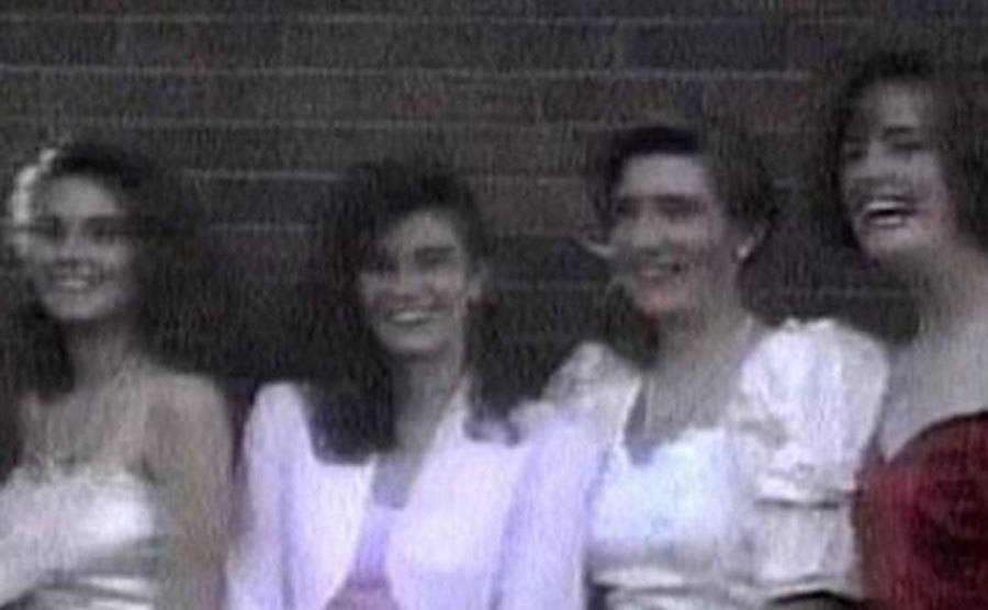 A dated picture of Kristen with her friends at a school dance.