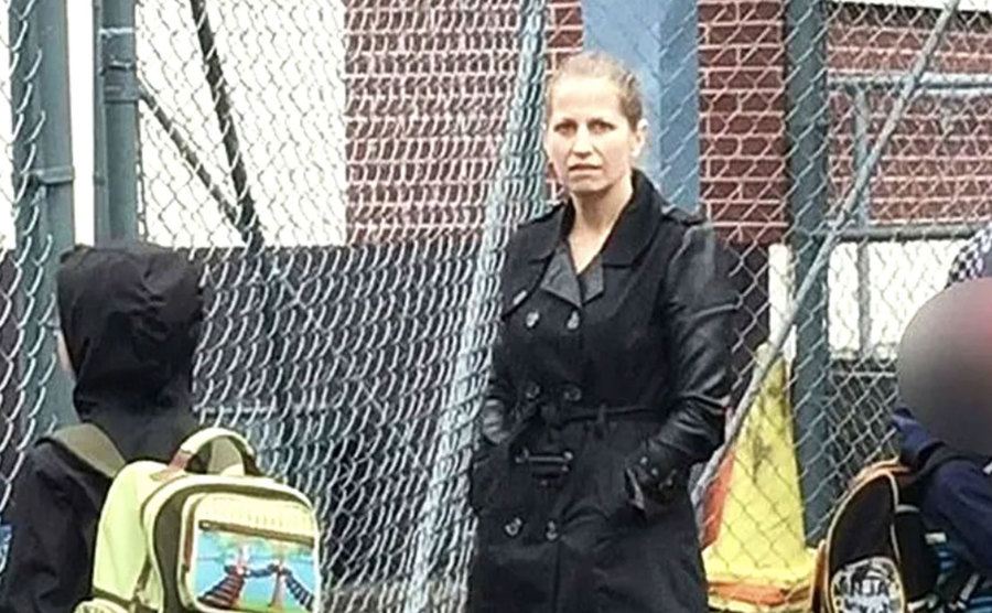 A video still of Karla Homolka with two kids.
