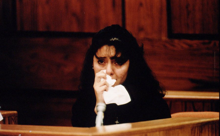 Lorena cries while she testifies in court.